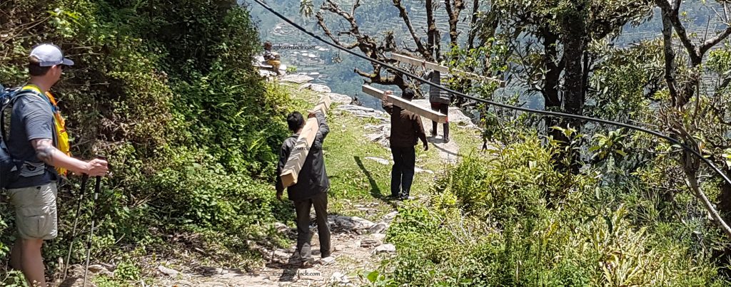 Nepalis carrying wood